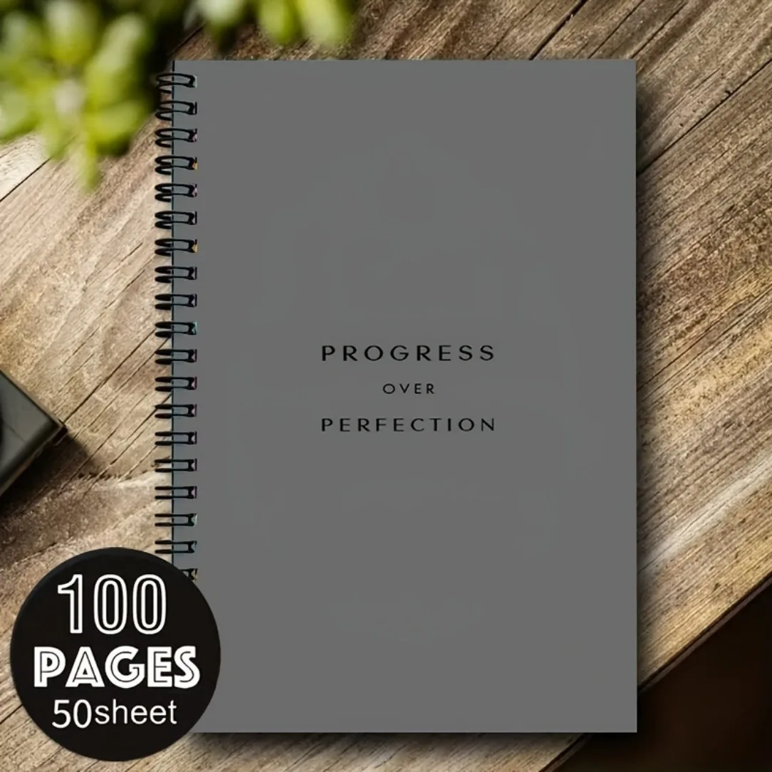 Cuaderno de espiral A5 gris con la frase Progress over perfection