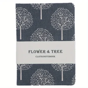 Cuaderno A6 de lona con árboles blancos sobre fondo oscuro y faja de papel