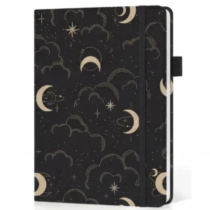 Diario negro con lunas y estrellas doradas, tapa dura y banda elástica, hojas punteadas