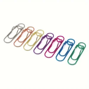 Siete clips sujetapapeles de metal en colores con muesca en forma de corazón