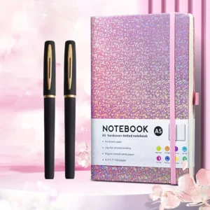 Set de cuaderno A5 punteado con cubierta rosa de brillo holográfico y 2 bolígrafos de gel
